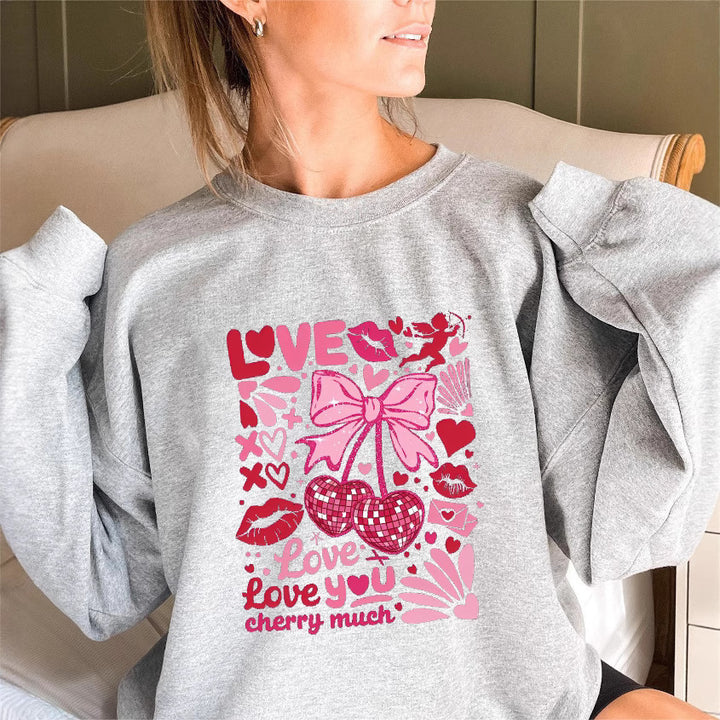 Sweat-shirt pour femmes avec des manches volumineuses et un motif cerise ludique Chic & Stil