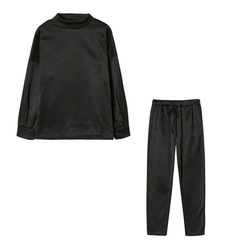 Ensemble de survêtement pour femmes avec une coupe moderne, un haut à col montant et un pantalon élastique Chic & Stil