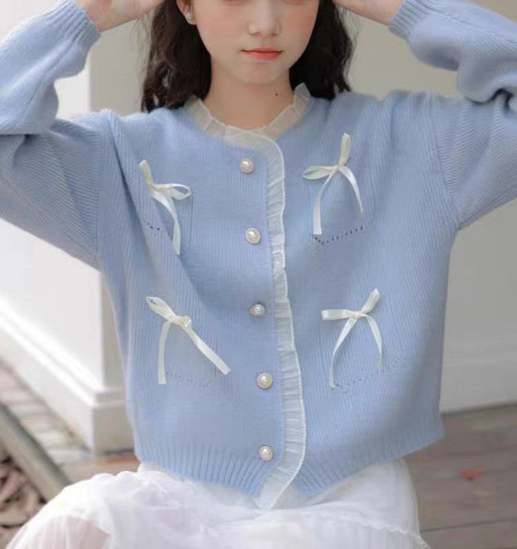 Knitted ladies' jacket with playful knots and pearl buttons Lune London