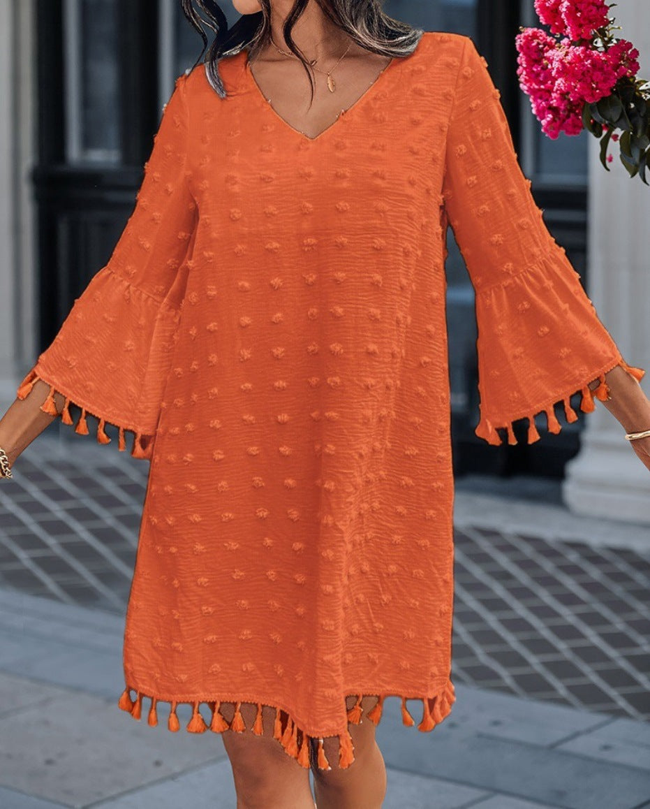 Beach dress for women with an elegant V-neckline and decorative fringes Lune London