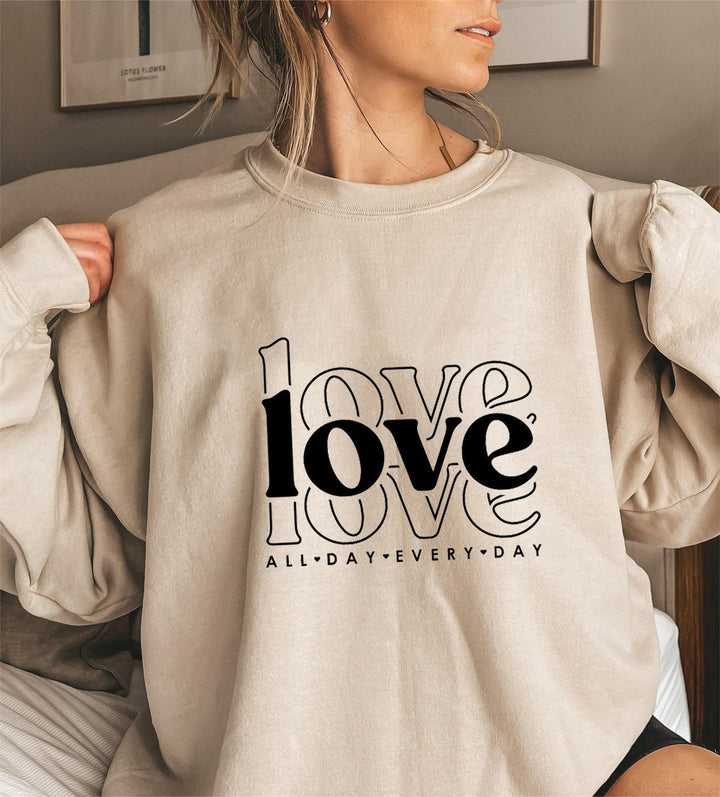 Sweat-shirt pour femmes avec des manches volumineuses et imprimé moderne "love" Chic & Stil
