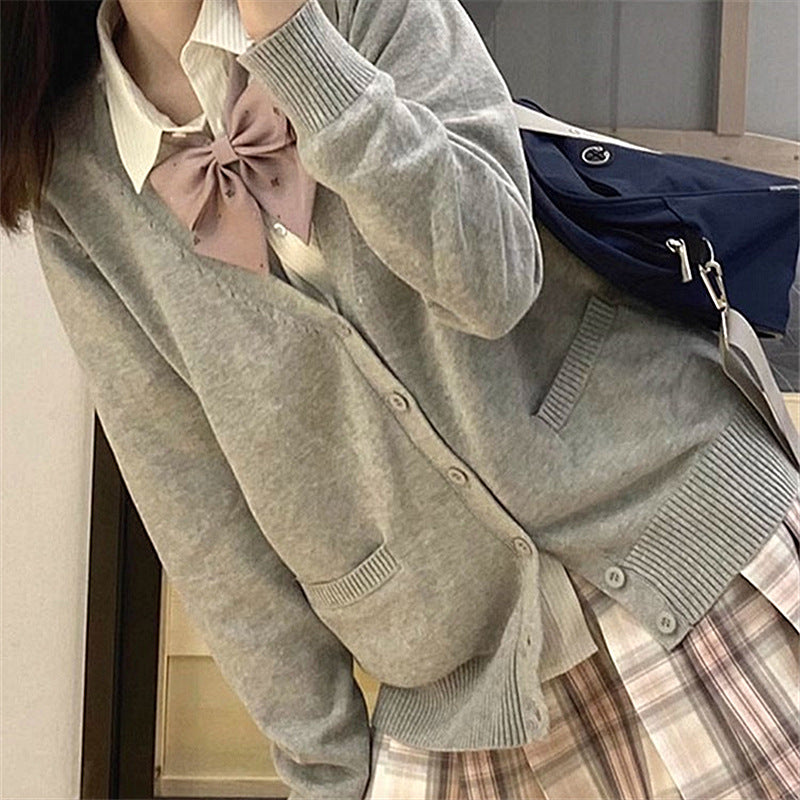 Cardigan féminin ludique avec grand col et détail de nœud Chic & Stil