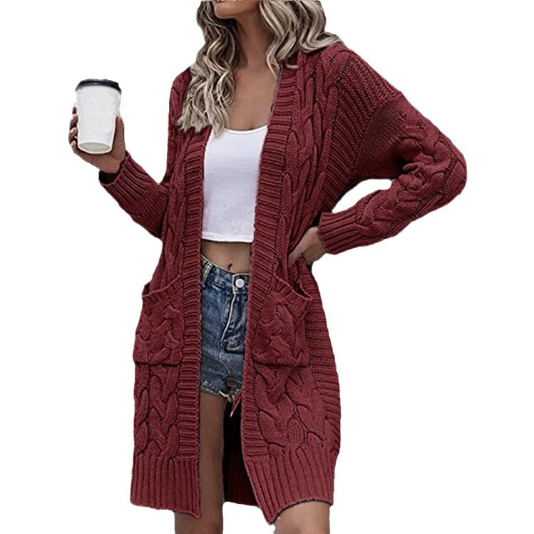 Ladies chunky knit cardigan with deep pockets and elaborate braids design Lune London