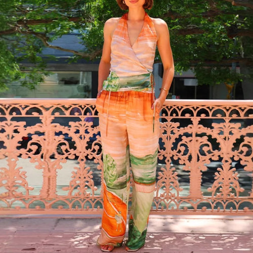 Women’s jumpsuit with deep V neckline and side tie belt Chic & Stil