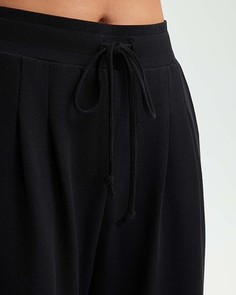 Pantalons décontractés amples pour femmes avec détails en bouton Chic & Stil