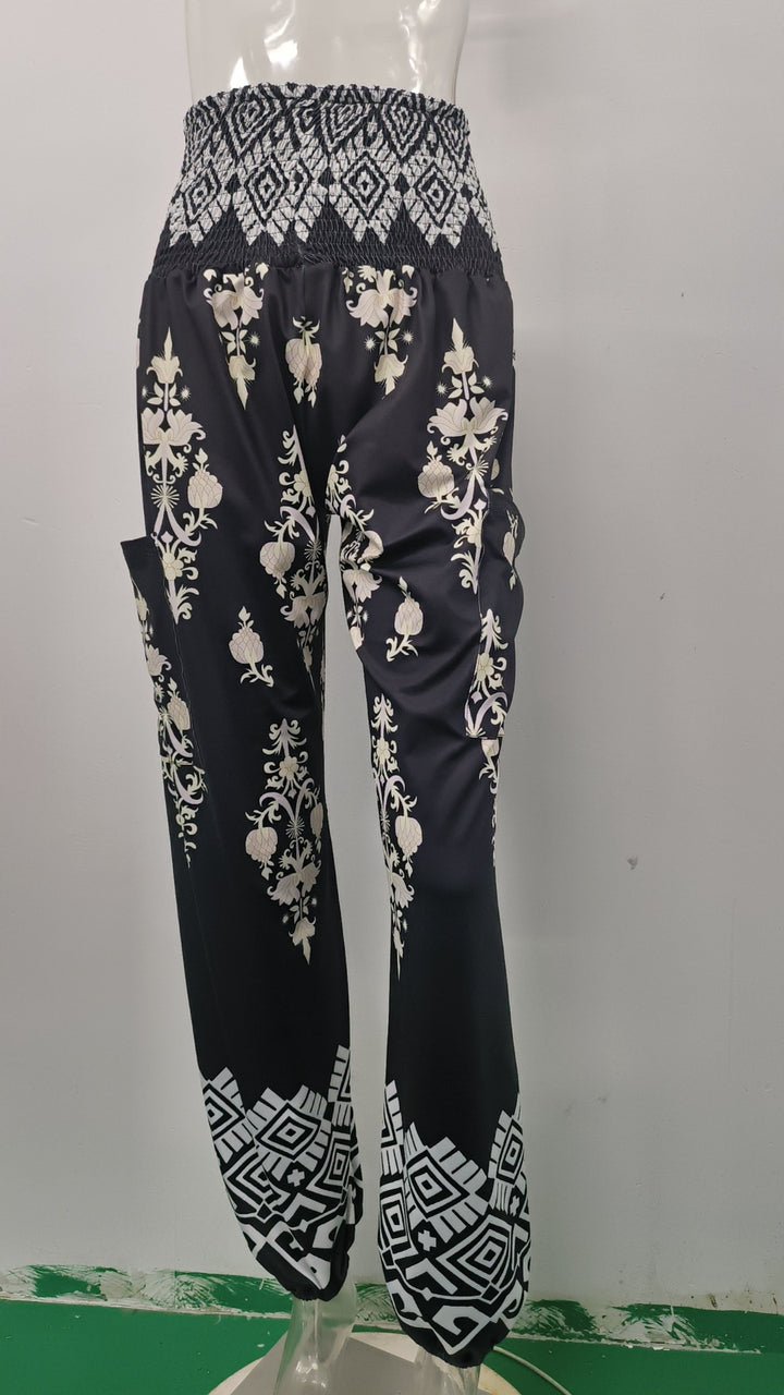 Wide Palazzo pants for women with colorful Paisley pattern and elastic waistband Lune London