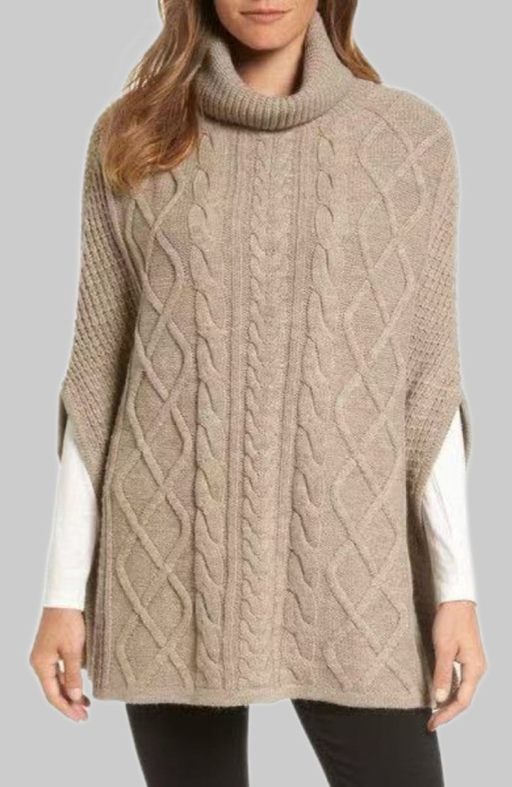 Knitted poncho for women with high collar and classic cable knit pattern Lune London