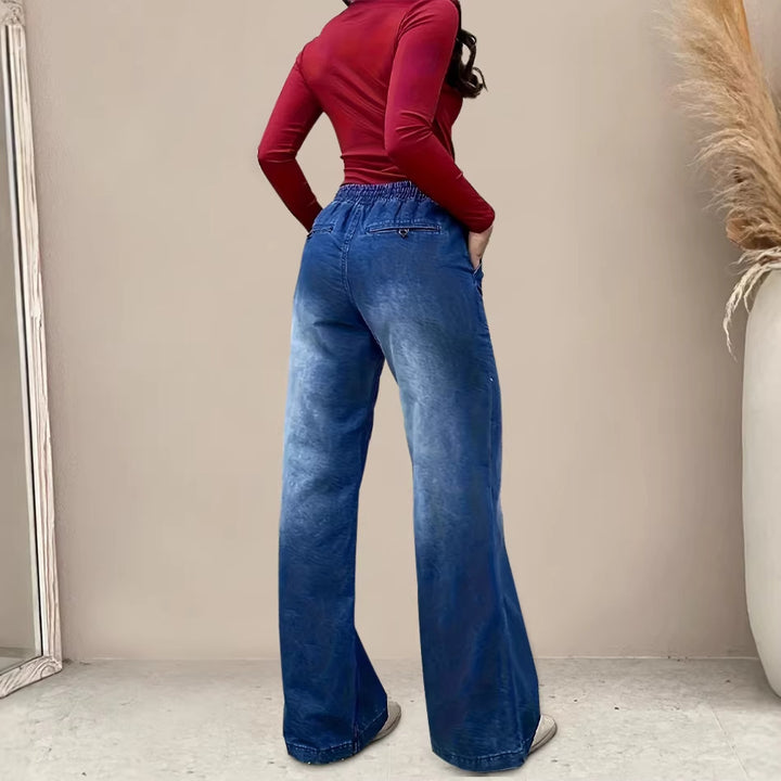 Women's wide-cut jeans with elastic waistband and trendy used look