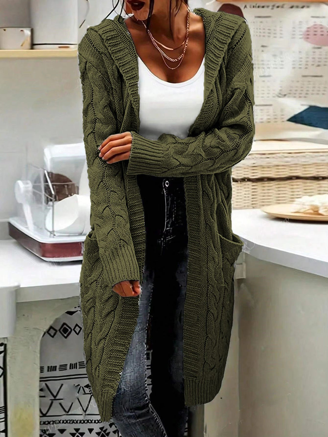 Ladies chunky knit cardigan with side pockets and structured cable design Lune London