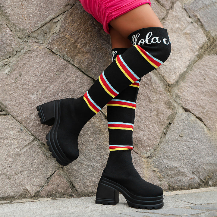 Women's boots in portrait format with colorful striped pattern and trendy block heel Lune London