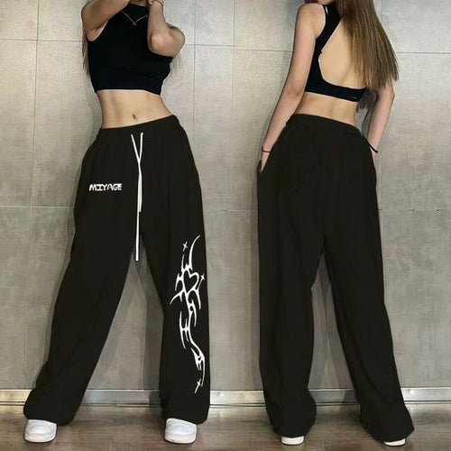 Women's casual leisure pants with a wide cut and striking graphic design Chic & Stil