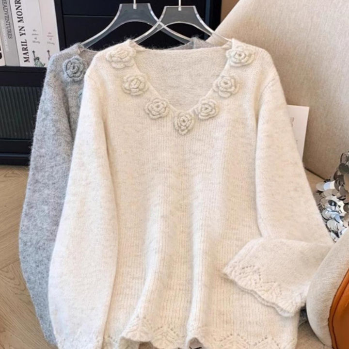 Pull en maille pour femmes avec accents floraux Chic & Stil