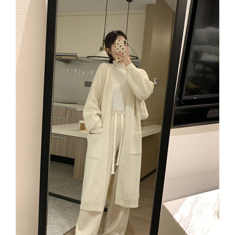 Ladies Long Knit Cardigan with practical pockets and chic elegant silhouette