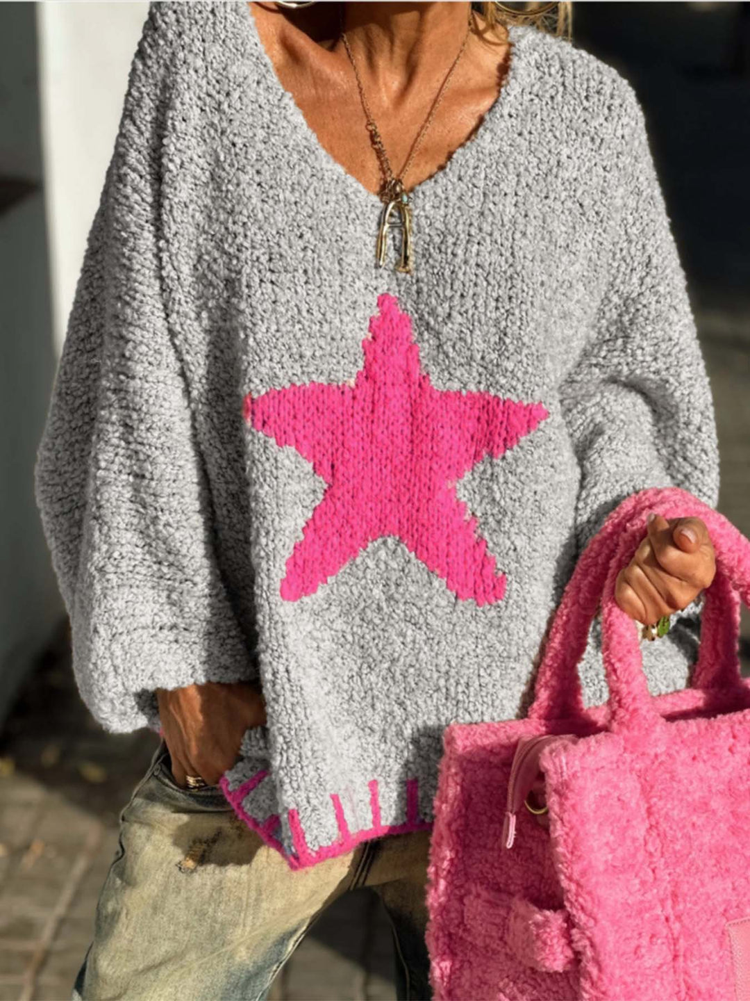 Women's knitted sweater with V-neck and striking star pattern Lune London