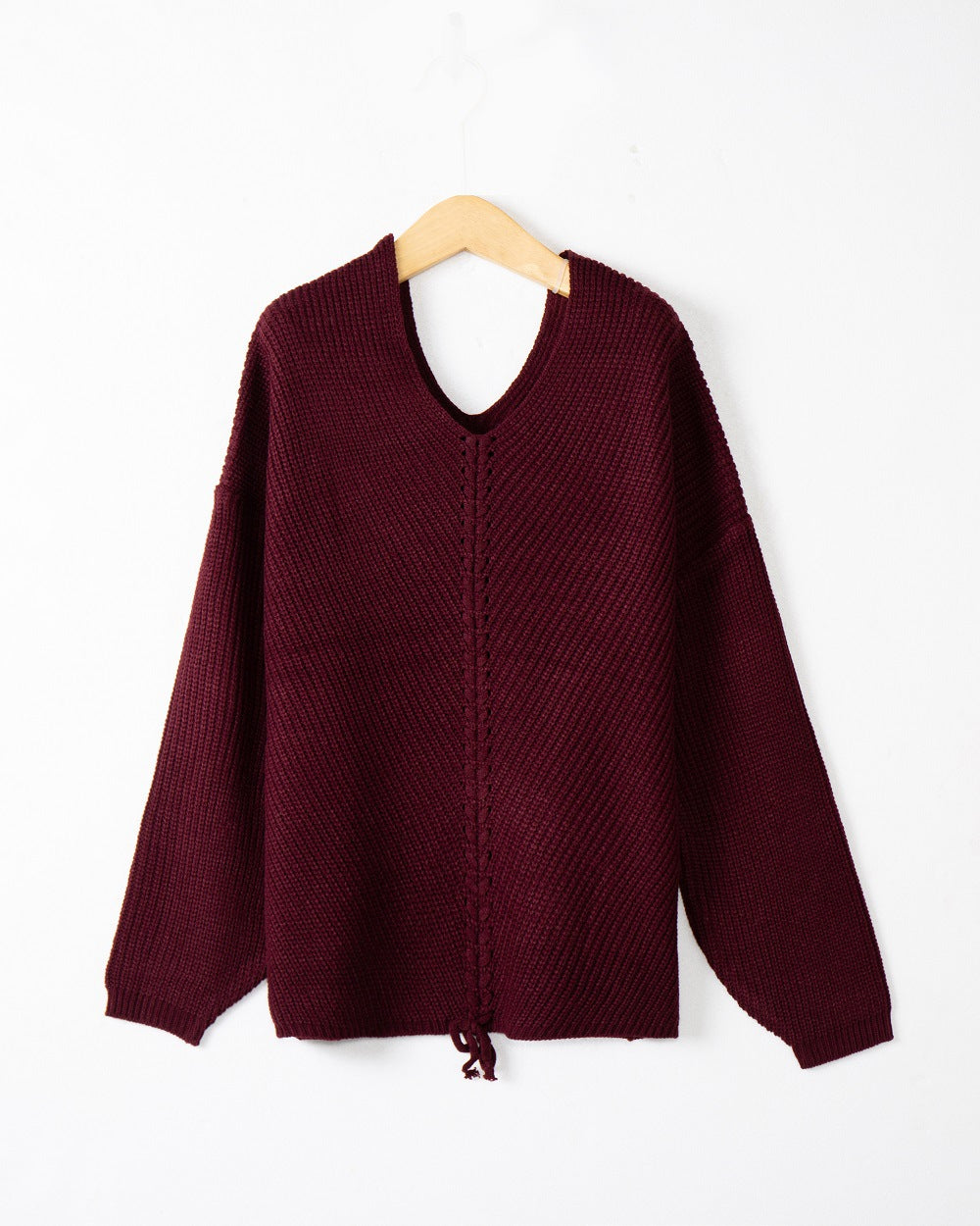 Women's thick knit sweater with an attractive V-neckline and practical drawstring details Lune London