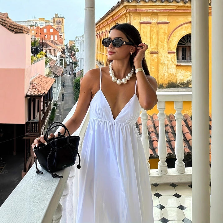 Lightweight summer dress for women with deep V-neck and spaghetti straps Lune London