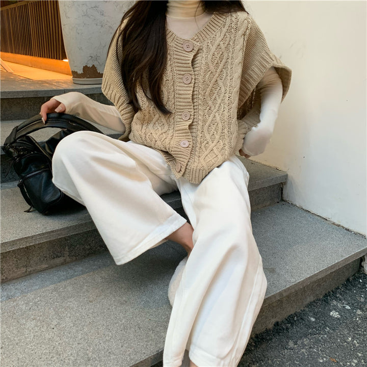 Pull en tricot pour femmes avec patte de boutonnage et motif en relief Chic & Stil