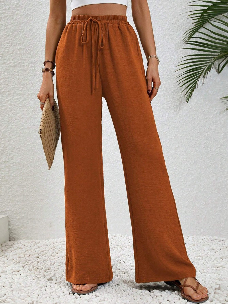 Pantalons larges d'été pour femmes avec taille élastique et poches latérales pratiques Chic & Stil