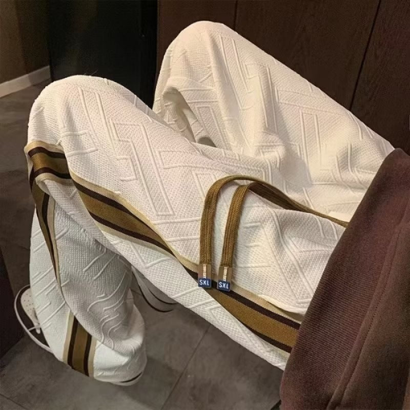 Women's leisure pants with textured design and side stripes Chic & Stil