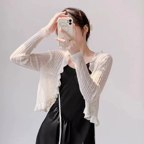 Women's knitted jacket with ruffle details and airy structure Lune London