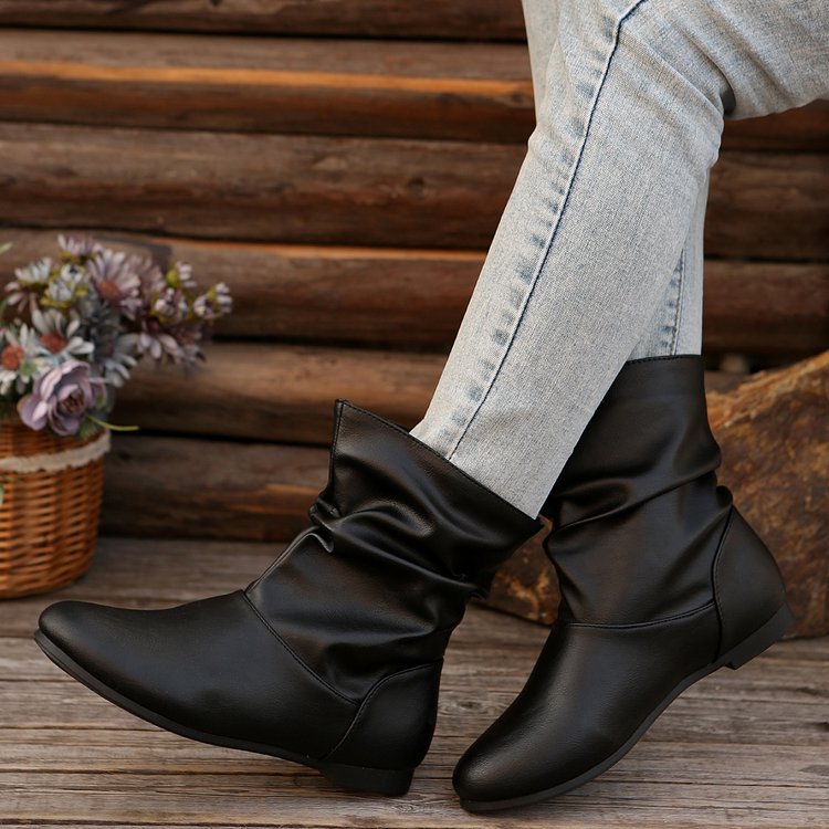 Fashionable women's ankle boots with an elegant ruffle design and a soft upper material Lune London