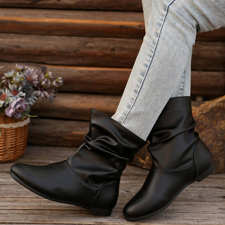 Fashionable women's ankle boots with an elegant ruffle design and a soft upper material Lune London