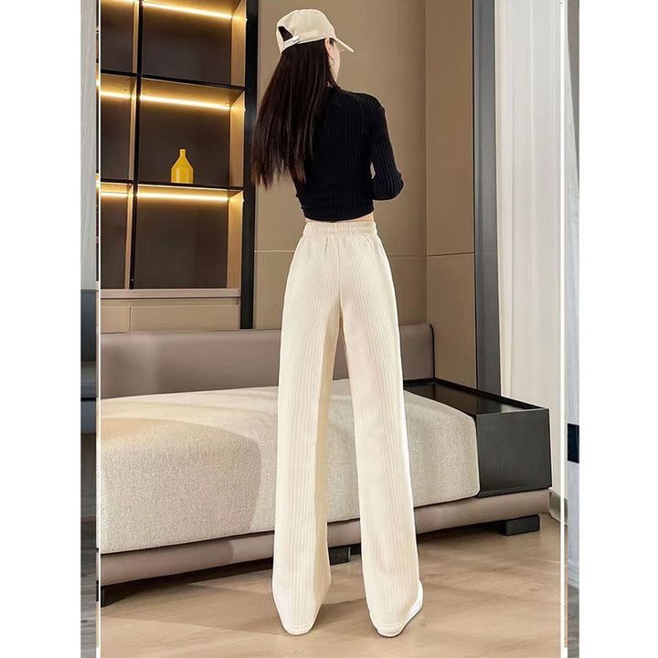 Women's high-waisted corduroy pants with wide leg and elastic waistband