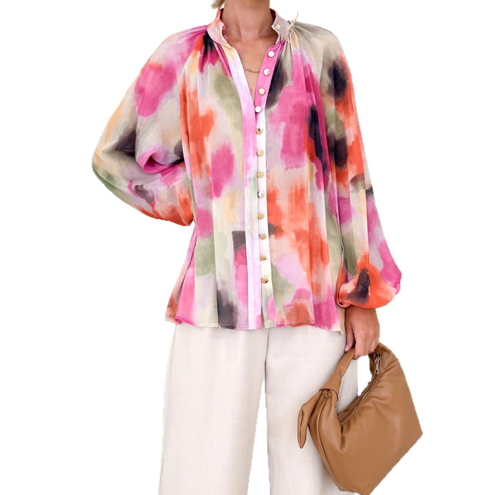 Women's blouse with a loose fit and elegant puff sleeves Chic & Stil