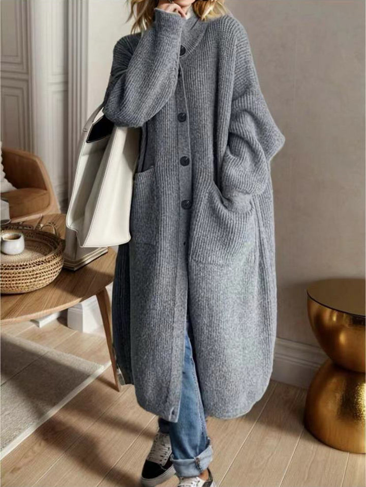 Trendy knitted jacket for women with generous pockets and chic button detail