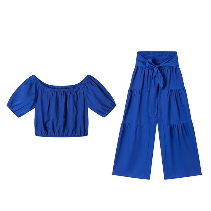 Woman Deep V-Neck Crop Top and High-Waisted Palazzo Pants Lune London