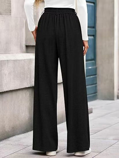 Loose fabric trousers for women with high waist and practical pockets. Chic and style