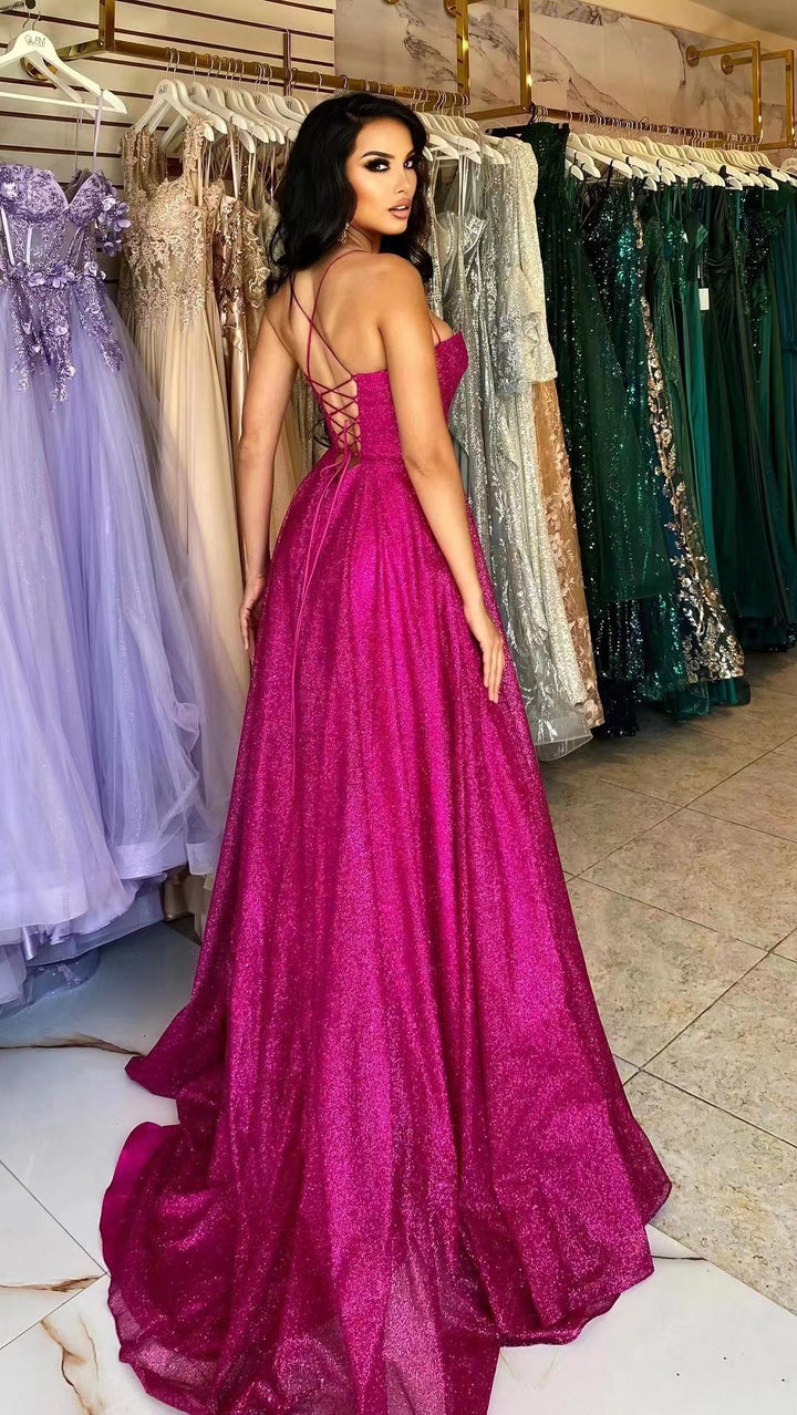 Glamorous evening dress for women with deep neckline and sparkling fabric Lune London