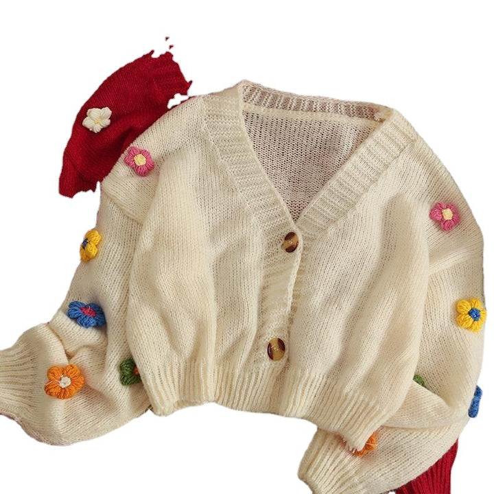 Ladies cozy knit cardigan with playful floral appliqués Lune London
