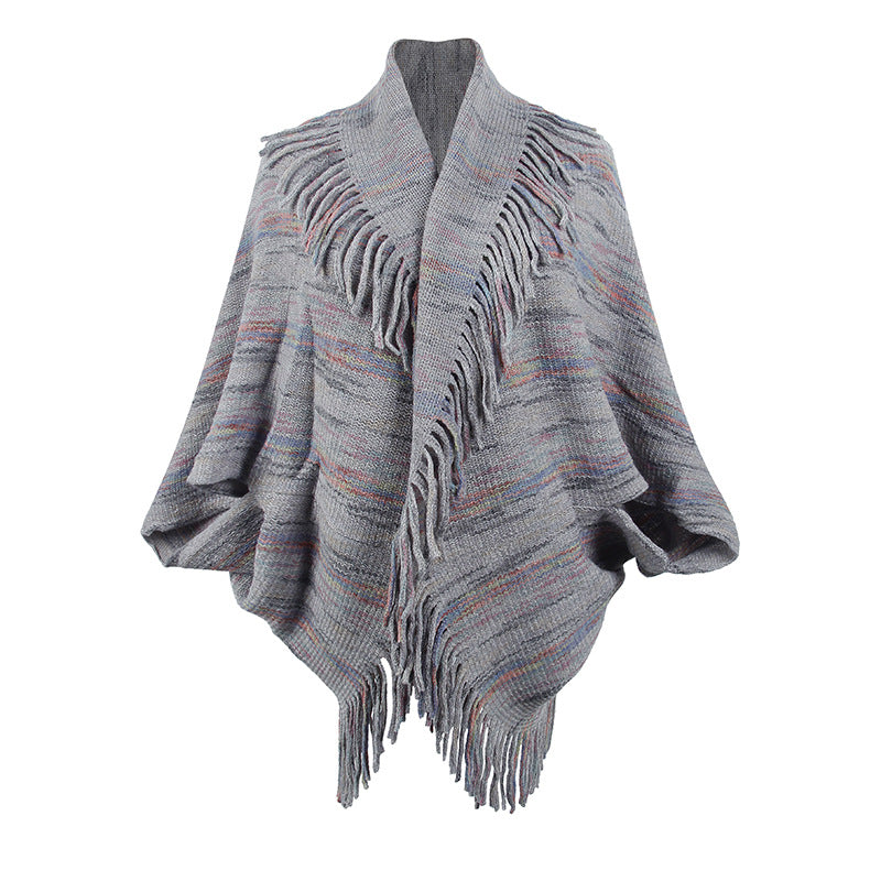 Ladies knitted poncho with luxurious fringes and a modern design Lune London