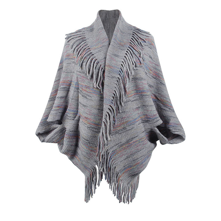 Ladies knitted poncho with luxurious fringes and a modern design Lune London