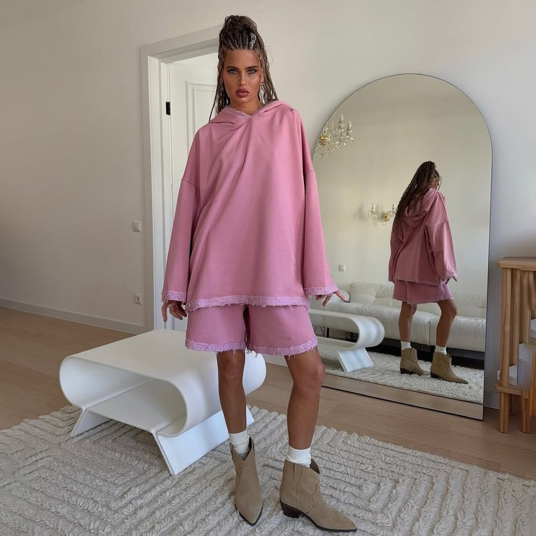 Ladies oversized sporty hoodie with frayed details and chic and stylish shorts set