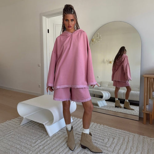 Ladies oversized sporty hoodie with frayed details and chic and stylish shorts set
