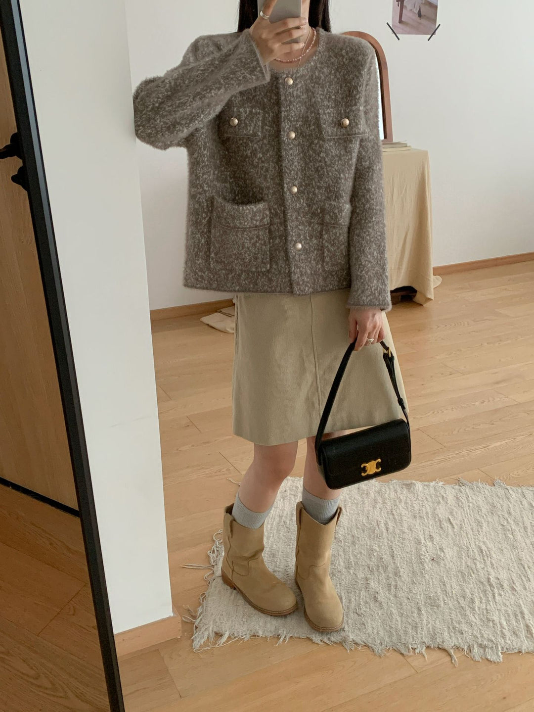 Veste en tricot confortable pour femmes avec détails en bouton et poches plaquées Chic & Stil