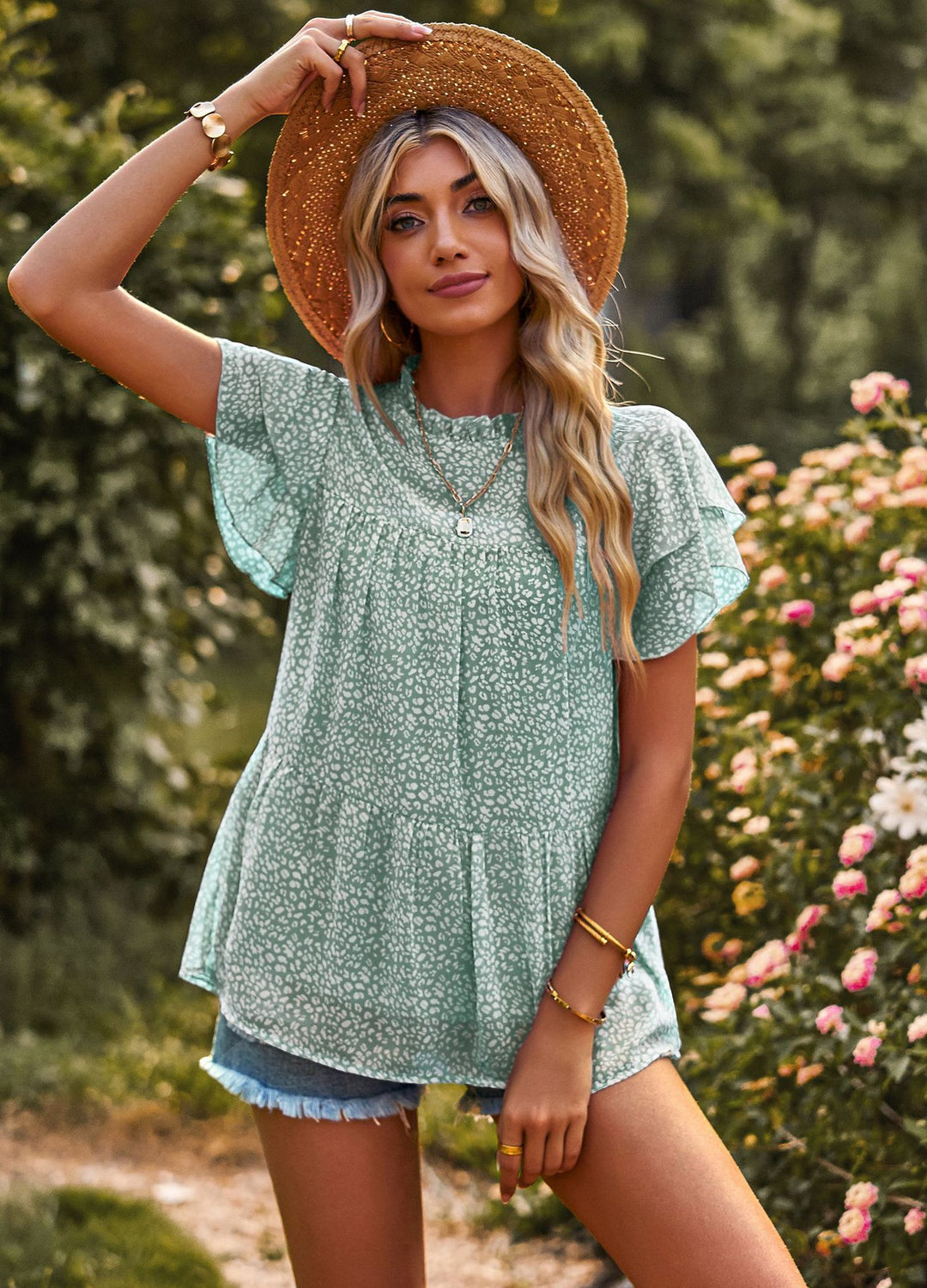Dynamic women's blouse with ruffled details and floral design Lune London