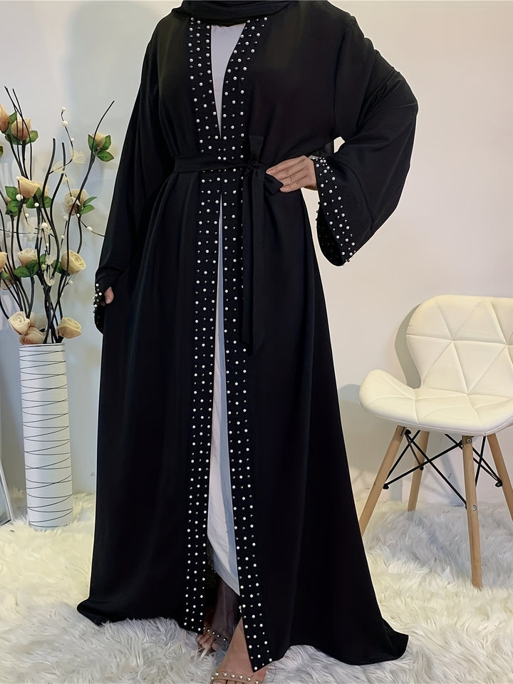 Elegant ladies Abaya with elaborate rhinestone details and a chic waist belt