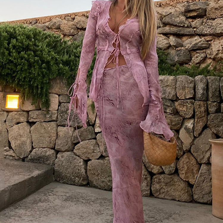 Elegant maxi dresses with cutouts for women featuring fluid fabric and refined ruffle details Lune London