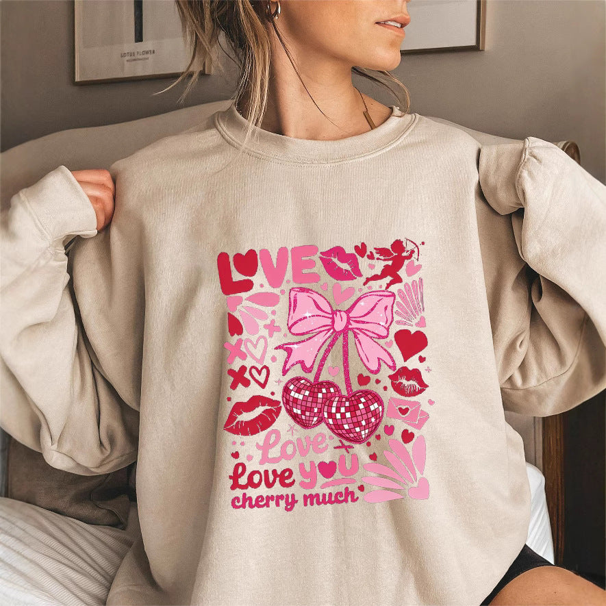 Sweat-shirt pour femmes avec des manches volumineuses et un motif cerise ludique Chic & Stil