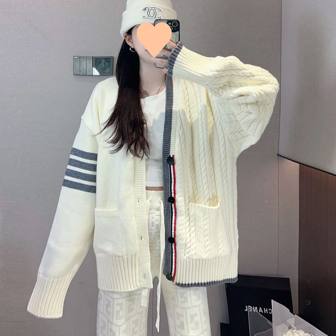 Women's chunky knit cardigan with cable pattern and generous pockets Lune London