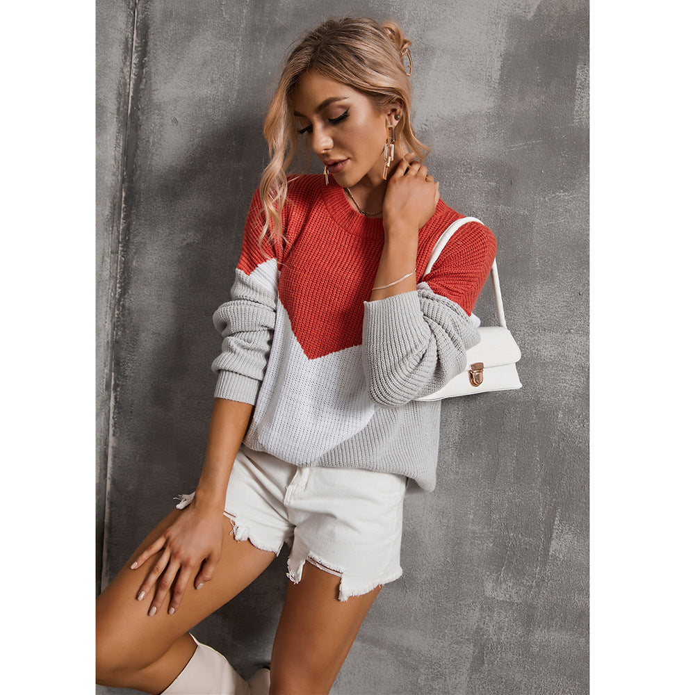 Femme pull en tricot à la mode avec un décolleté en V frappant et un design graphique Chic & Stil