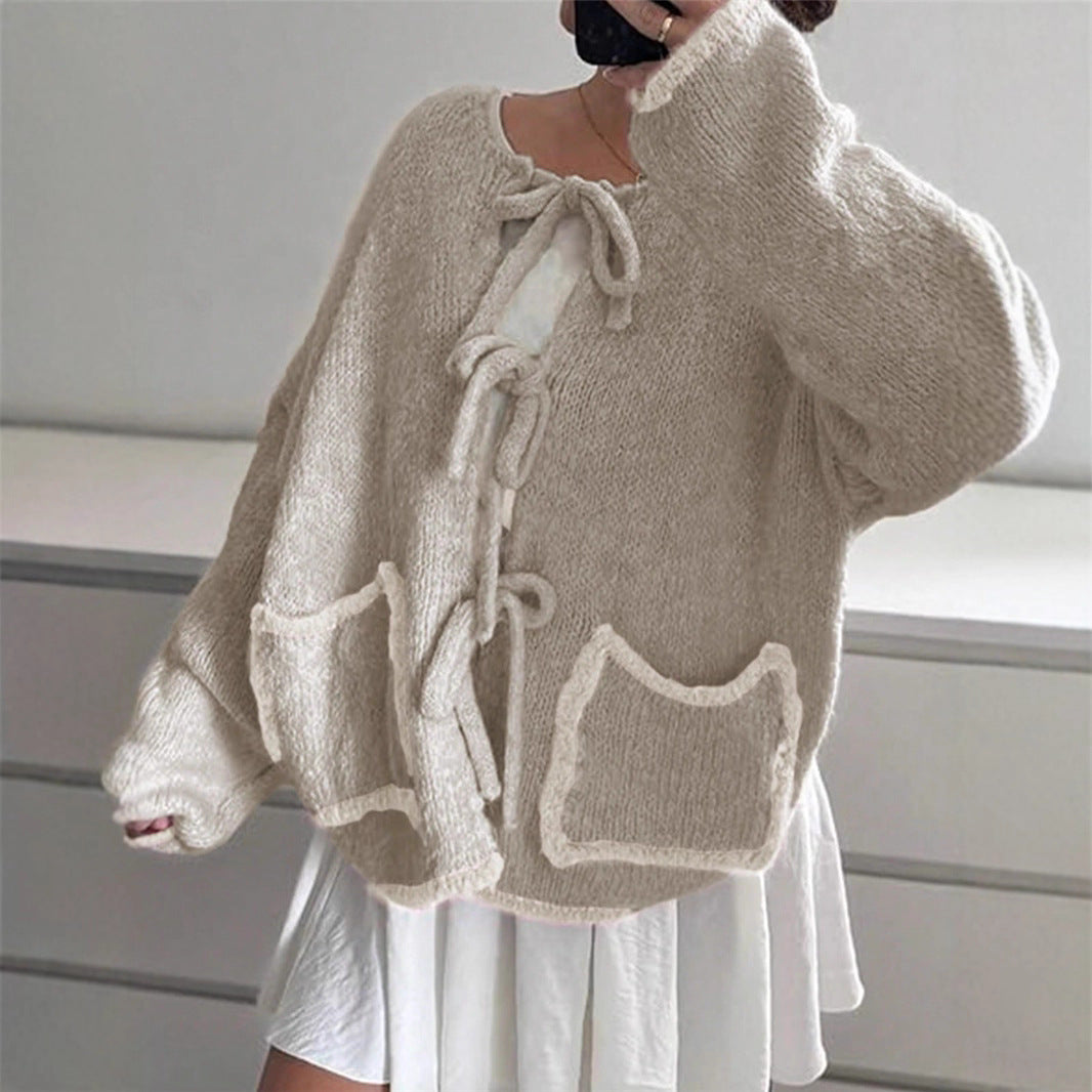 Ladies casual knit jacket with a unique tie detail and large pockets Lune London