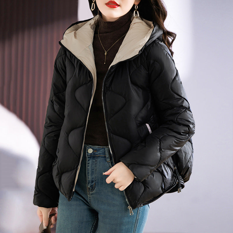 Insulated quilted jacket for women with high collar and practical zip pockets Lune London