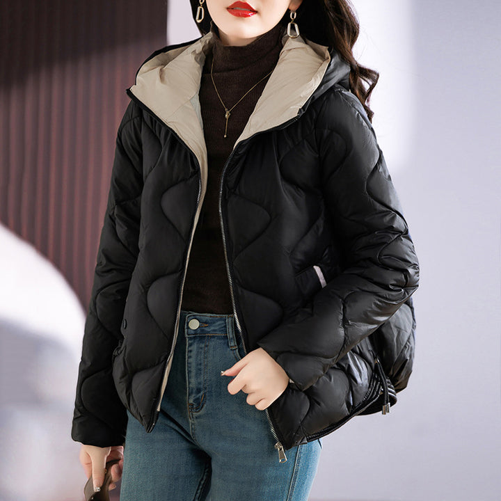 Insulated quilted jacket for women with high collar and practical zip pockets Lune London