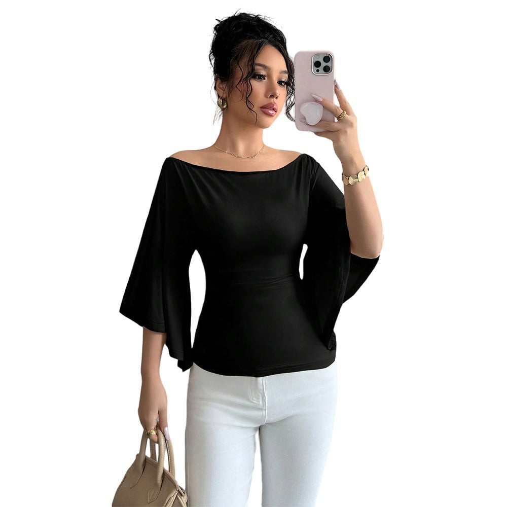 Elegant women's top with off-the-shoulder design, wide sleeves, and fitted cut Chic & Stil