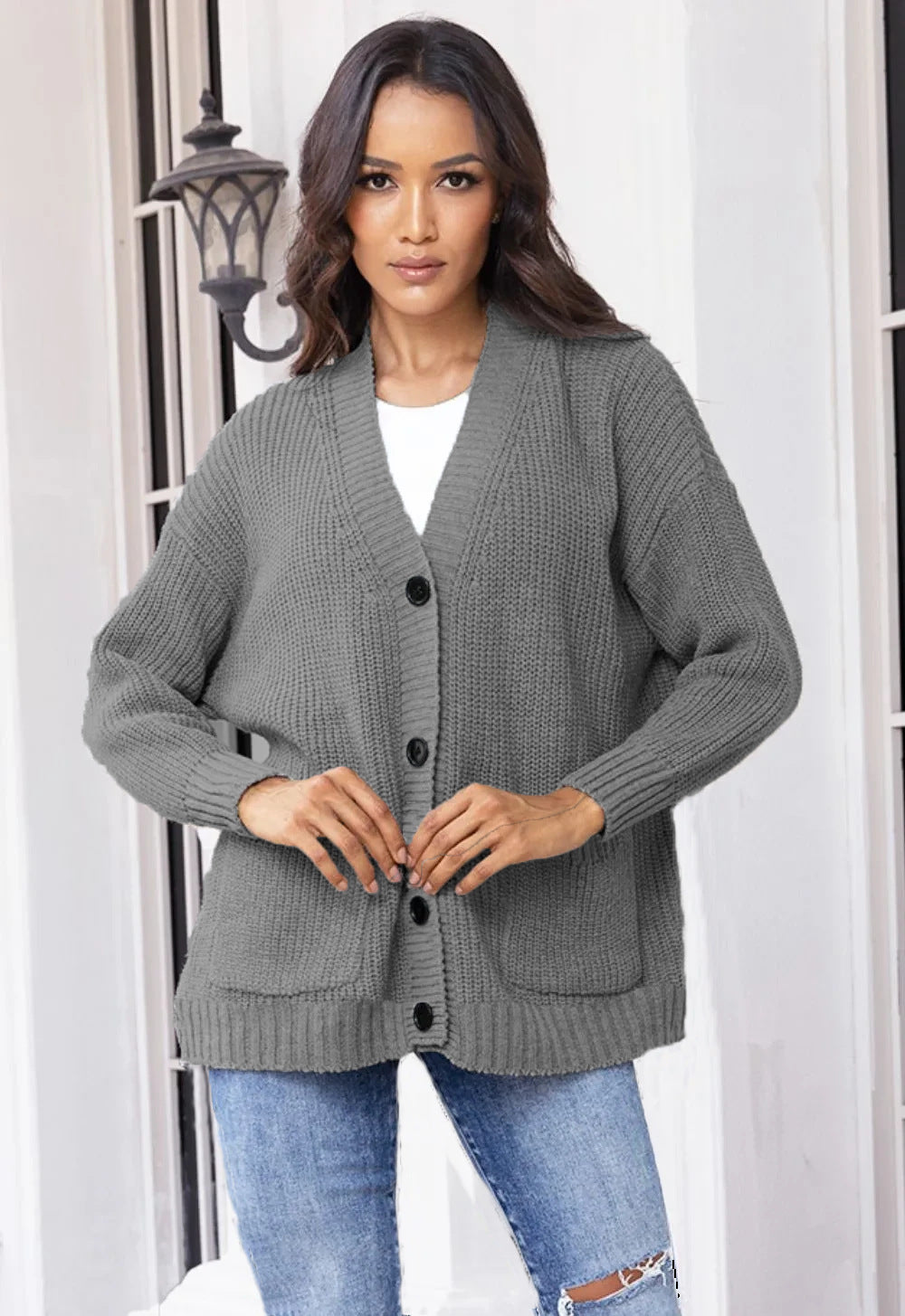 Fashionable knitted jacket for women with button closure all the way down and large pockets Lune London