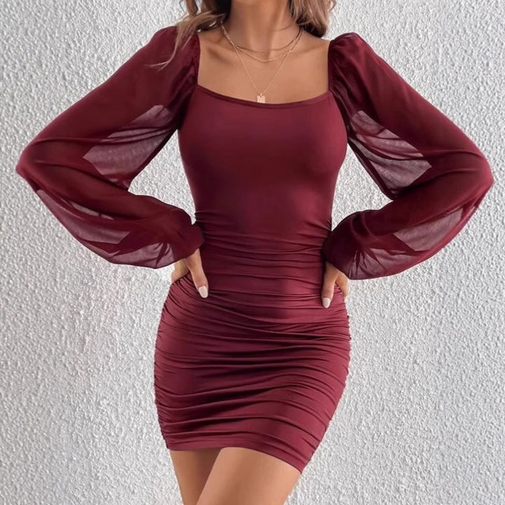 Short fitted dress for ladies with sheer puff sleeves and ruffle details Lune London